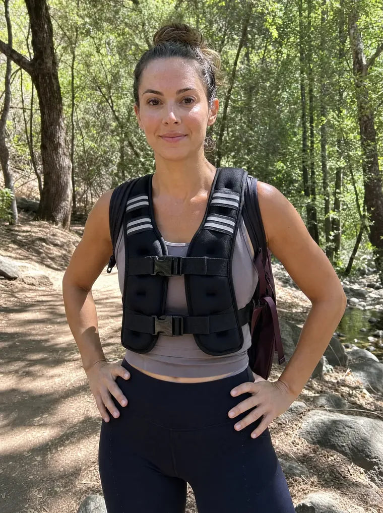 Lauren P. on a sunny trail wearing the Givorn vest