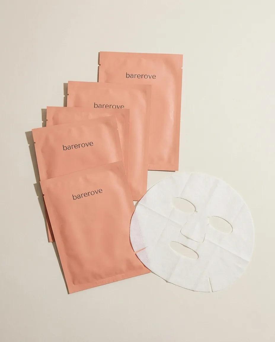 The mask sheet on white, showing its shape and eye and mouth cutouts