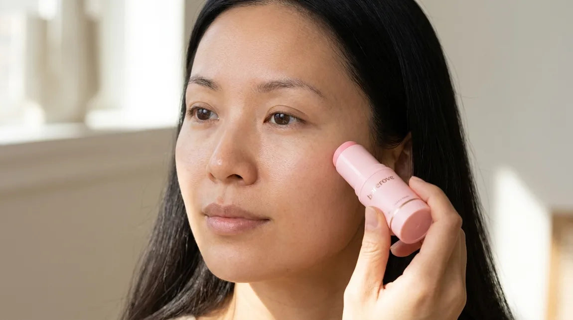 A swipe of the pink balm stick under the eye, close up