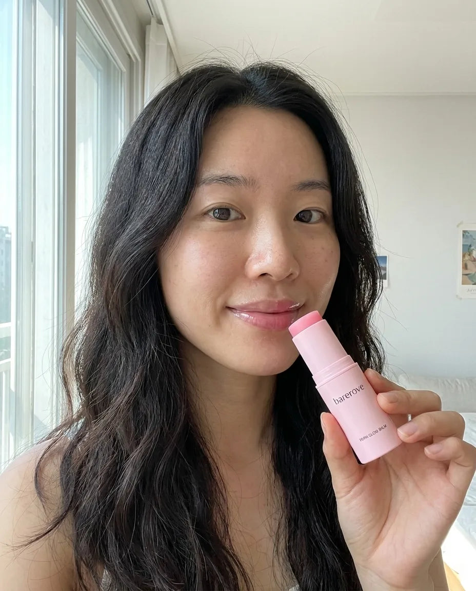 customer holding the balm stick, plump glowing lips